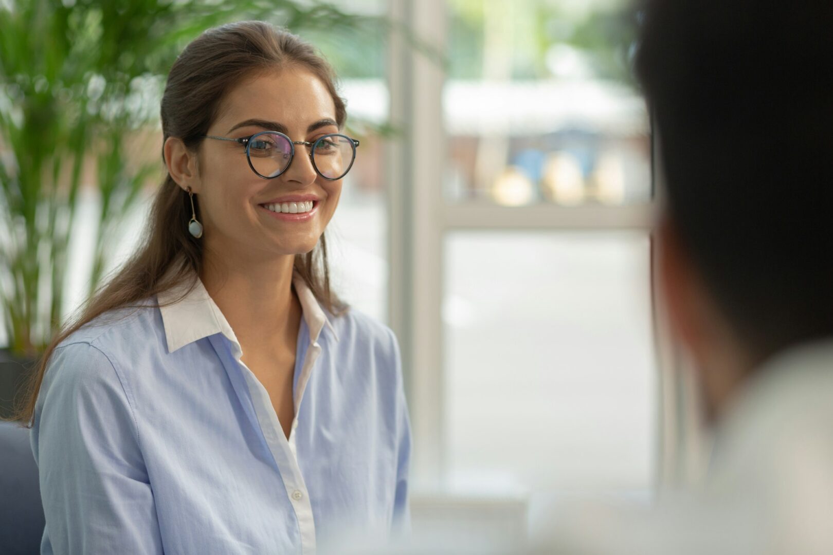 Positive delighted young woman being in all ears